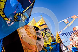 Flags of the brotherhood of Sbandieratori Di Fivizzano parading in a medieval festival