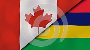 The flags of Canada and Mauritius. News, reportage, business background. 3d illustration