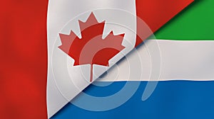 The flags of Canada and Sierra Leone. News, reportage, business background. 3d illustration