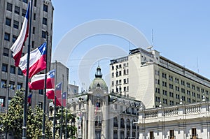 Flags of Chile in front of the Presidential Palace - Palacio de la Moneda - in Santiago de Chile, Chile