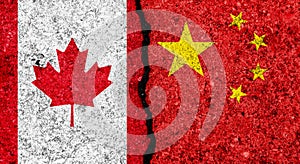 Flags of China and Canada painted on cracked grunge wall background/Canada and China relations and conflict concept