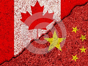 Flags of China and Canada painted on cracked grunge wall background/Canada and China relations and conflict concept