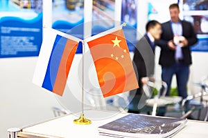 Flags of China and Russia at business exhibition