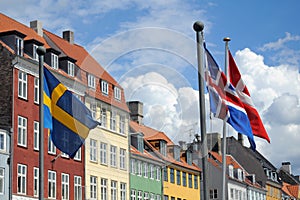 Flags and colored houses in Copenhagen, Denmark