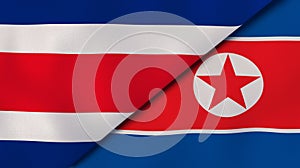 The flags of Costa Rica and North Korea. News, reportage, business background. 3d illustration
