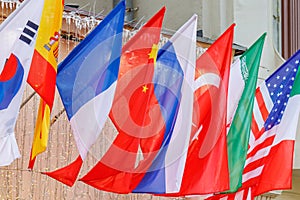 Flags of different countries close-up in sunlight