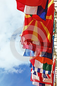 Flags of Europe states against cloudy sky