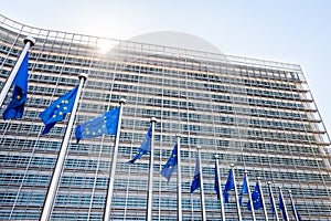 Flags of the European Union blowing in the wind in front of the European Commission in Brussels, Belgium