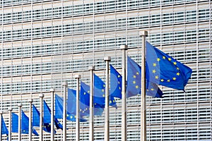 Flags of the European Union blowing in the wind in front of the European Commission in Brussels, Belgium