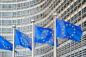 Flags of the European Union blowing in the wind in front of the European Commission in Brussels, Belgium