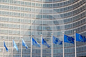 Flags of the European Union blowing in the wind in front of the European Commission in Brussels, Belgium