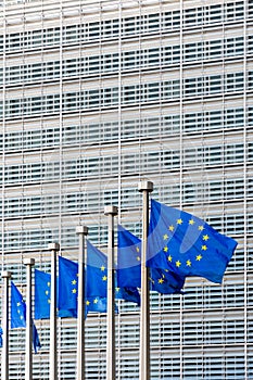 Flags of the European Union blowing in the wind in front of the European Commission in Brussels, Belgium