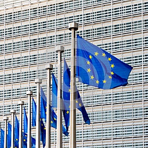 Flags of the European Union blowing in the wind in front of the European Commission in Brussels, Belgium