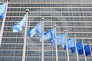 Flags of the European Union blowing in the wind in front of the European Commission in Brussels, Belgium