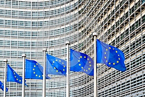 Flags of the European Union blowing in the wind in front of the European Commission in Brussels, Belgium