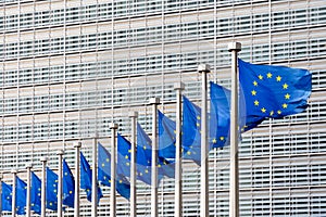 Flags of the European Union blowing in the wind in front of the European Commission in Brussels, Belgium