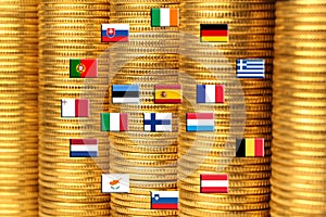 Flags of eurozone countries against piles of coins