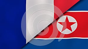The flags of France and North Korea. News, reportage, business background. 3d illustration