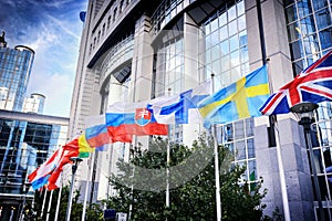 Flags in front of European Parliament building. Brussels, Belgium