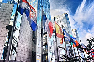 Flags in front of European Parliament building. Brussels, Belgium