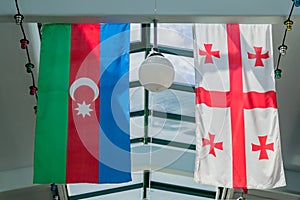 Flags of Georgia and Azerbaijan hanging on the ceiling