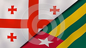 The flags of Georgia and Togo. News, reportage, business background. 3d illustration