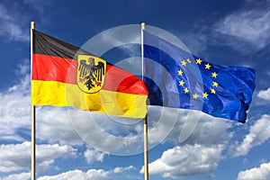 Flags of Germany Federal Republic of Germany; in German: Bundesrepublik Deutschland and the European Union EU waving in wind