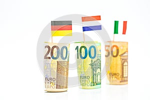 Flags of Germany, France and Italy euro bills on a white background.euro inflation.Changes in the budget.Inflation and