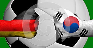 Flags of Germany and South Korea painted on two clenched fists facing each other with closeup 3d soccer ball in the background/Soc