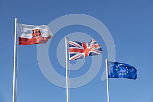 The flags of Gibraltar, United Kingdom and the EU flying in Gibraltar