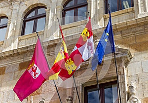 Flags on the historic Guzmanes palace in Leon photo