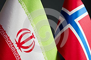 Flags of Iran and Norway next to each other.