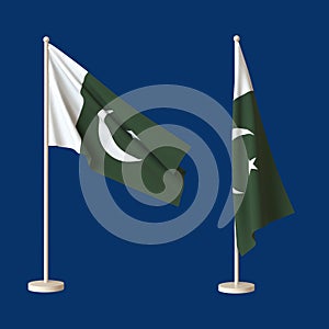 Flags of the Islamic Republic of Pakistan fluttered from a flagpole and twisted against a neutral background.