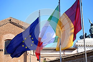 Flags of Italy, European Union and Roma city waving in Rome, Italy