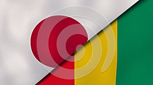 The flags of Japan and Guinea. News, reportage, business background. 3d illustration