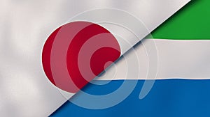The flags of Japan and Sierra Leone. News, reportage, business background. 3d illustration