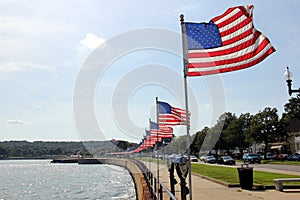 Flags-lined embankment of the Western Harbor at Stacy Blvd, Gloucester, MA, USA