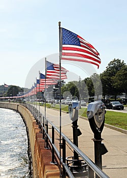 Flags-lined embankment of the Western Harbor at Stacy Blvd, Gloucester, MA, USA