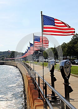 Flags-lined embankment of the Western Harbor at Stacy Blvd, Gloucester, MA, USA