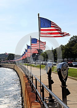 Flags-lined embankment of the Western Harbor at Stacy Blvd, Gloucester, MA, USA