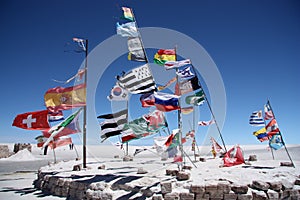 Flags of many countries in a salt desert of Salar de Uyuni