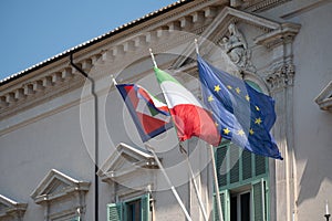 Flags outside the Quirinal Palace in Rome, Italy