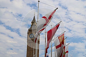 The flags of Parliament Square with Big Ben in the background, London photo