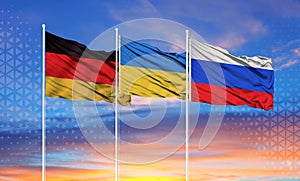 Flags of Russia, Ukraine and Germany The concept of tense relations between Russia and Ukraine.