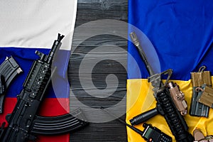 Flags of Russia and Ukraine with weapon rifles