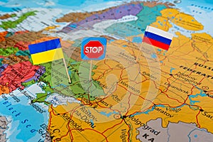 Flags of Russia and Ukraine on world map. Stop war concept, hot spot defending territory