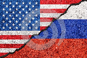 Flags of Russia and USA painted on cracked wall background/Russia versus USA conflict concept