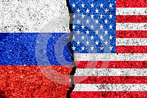 Flags of Russia and USA painted on cracked wall background/Russia versus USA conflict concept