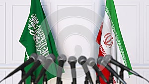 Flags of Saudi Arabia and Iran at international meeting or negotiations press conference