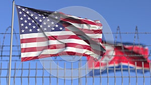 Waving flags of the USA and North Korea separated by barbed wire fence. Conflict related conceptual 3D rendering